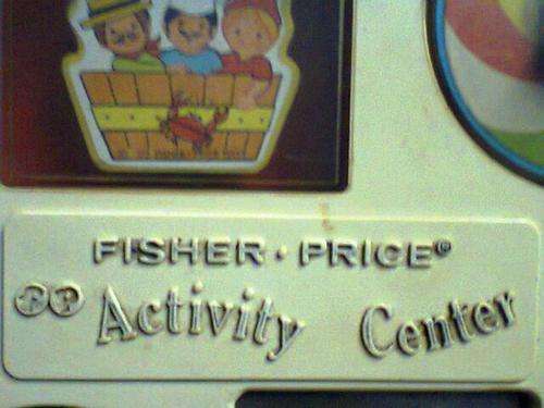 A VINTAGE FISHER - PRICE " ACTIVITY CENTER " from the early 1970's in good condition for it's AGE.