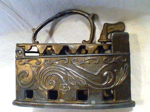 A Old Vintage Ornament. A small Gilded Gold Coloured Peweter Caol Iron. Size: 10cm Long x 4.5cm Wide