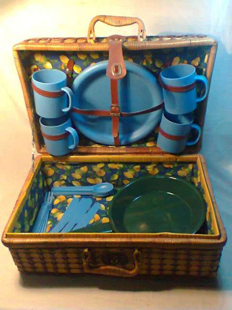 A Awesome Retro Picnic Basket with 4 of every thing plus a Enamel Fry pan. In good used condition.