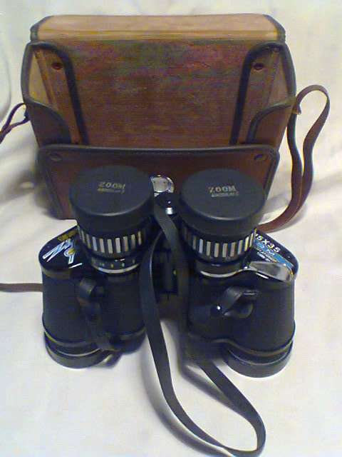 A Old " Tasco " binocular set In a case 7X-15 325Ft @ 1000yrd's With Strap & Needs a little TLC.