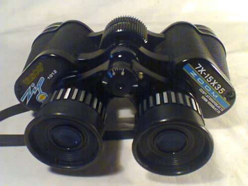A Old " Tasco " binocular set In a case 7X-15 325Ft @ 1000yrd's With Strap & Needs a little TLC.