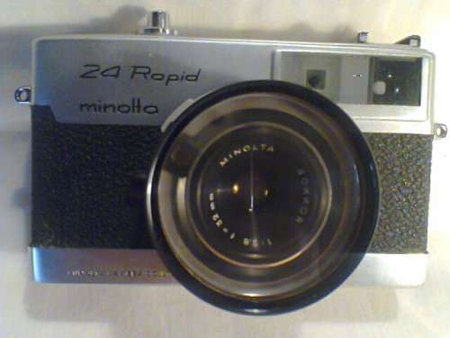 A Rare 32mm "Minolta" 24 Rapid with Rokkor Lens Camera in Leather case. In good d S/hand condition.