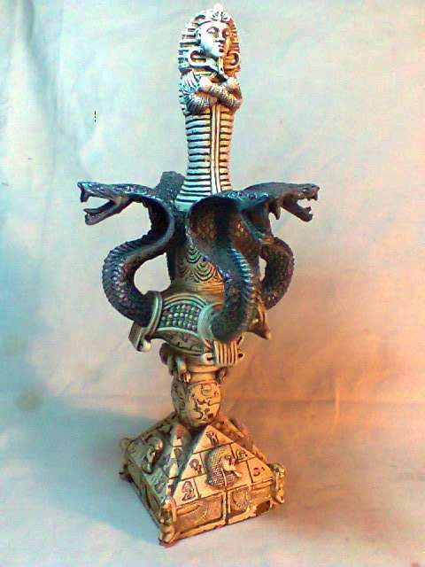 Over 80 year old this Exquisite Egyptian Dagger Guarded by 4 serpents on stand. Good order for Age.