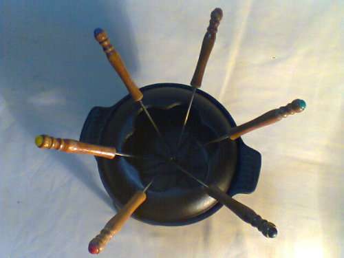 A Almost new never Used Cast Iron complete "Premier FONDUE set" Ready for U to set out at the party.