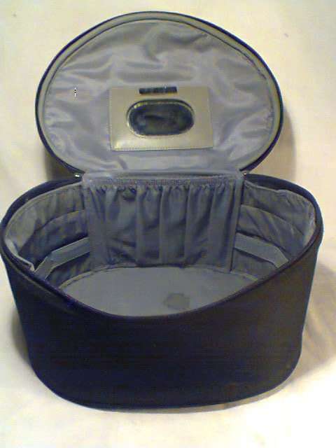 A Large Vintage Ladies "Revlon" Vanity case with satin lined & Zips.In good second hand condition.