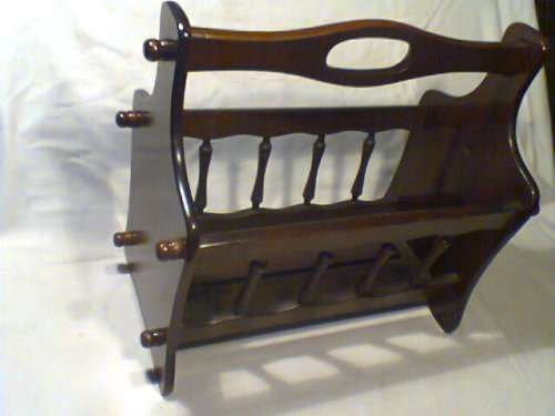 A Vintage Magazine rack in outstanding condition. Ideal for display in the lounge.Size:44cm L 39H