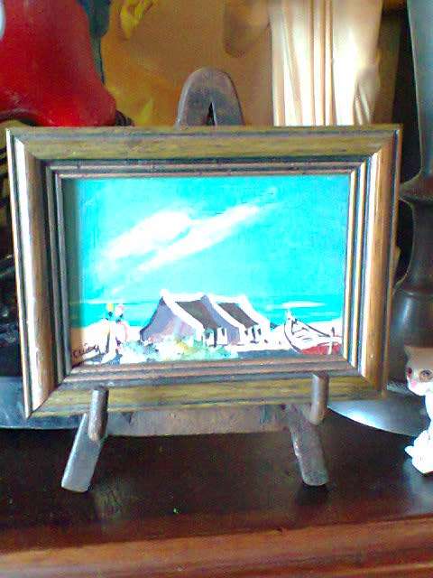 2 Collectible elegant wooden frames plus a small Oil on steel Easel.Good second hand use Condition