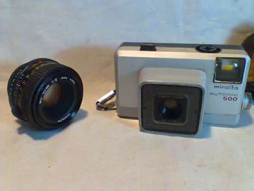 2 Items. A Rare 50mm "Minolta" Lens & Autopak 500 Rokkor Camera in case. In good d S/hand condition.