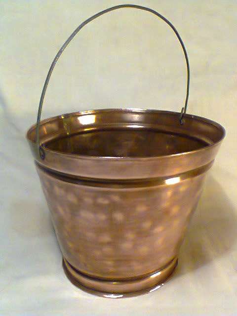 A Hand Beaten 1 litre Copper Bucket checked no leaks. In good condition. Sold as used in second hand