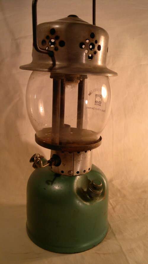 A 1953 Model 241G in Original comdition. Coleman Kerosene Lamp with glass. Sold as used Secondhand.