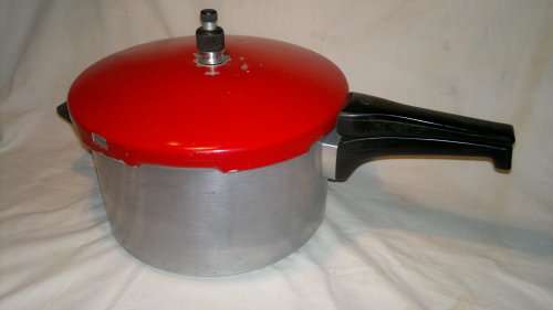 A Vintage "Tedelex" Pressure cooker with receipt book & 3 smaller pot's & defuse plate & regulator