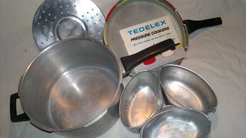 A Vintage "Tedelex" Pressure cooker with receipt book & 3 smaller pot's & defuse plate & regulator