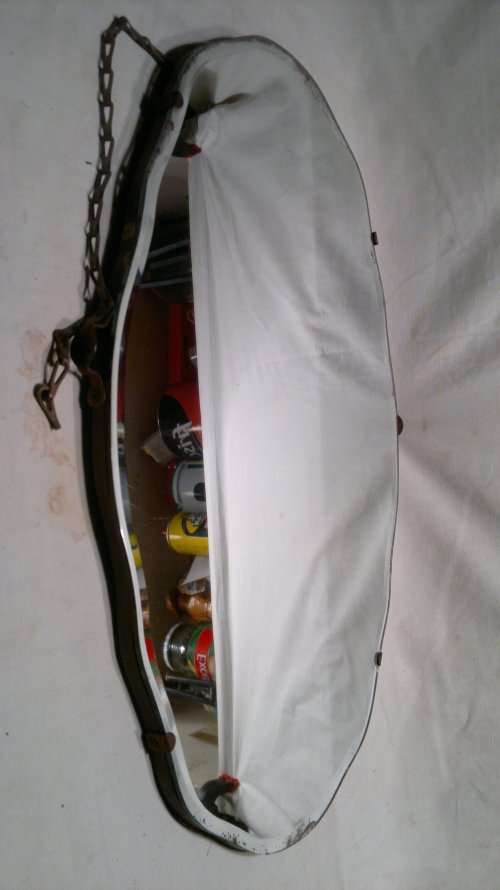 A Vintage Dressing table Beveled Mirror rigged up to hang on wall.Still has brackets plus chain on.