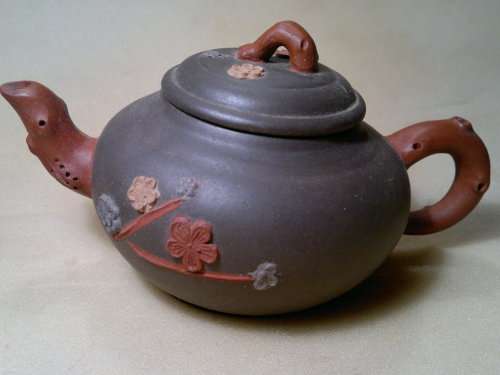 A Vintage Chinese Yixing Pottery Tea pot Signed under and flowers on the side with No damage.