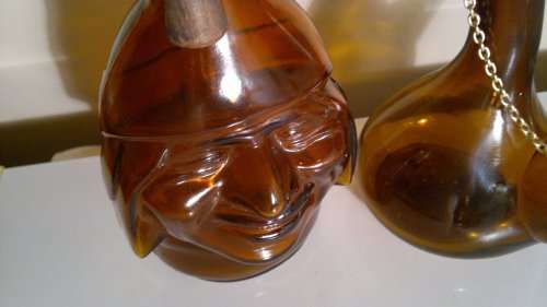 WoW 2 Unique Brown bottles. A Monk made in ITALY and a Wine flask with stopper & chain. Sold as used
