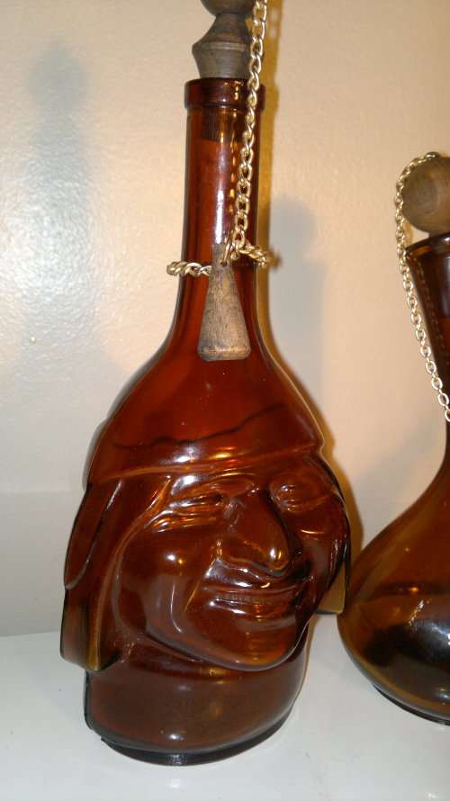WoW 2 Unique Brown bottles. A Monk made in ITALY and a Wine flask with stopper & chain. Sold as used