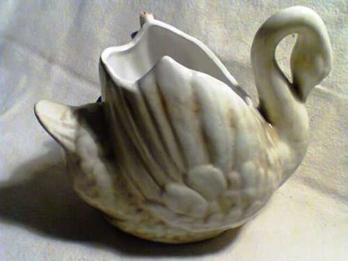 A Large Swan Vase with flower motif. Ideal for display in the lounge. In Fair to good condition.