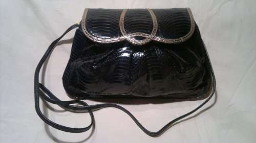 A Vintage " J. RENEE' " from an estate of a Opera singer. It's Hand made Genuine Snake.