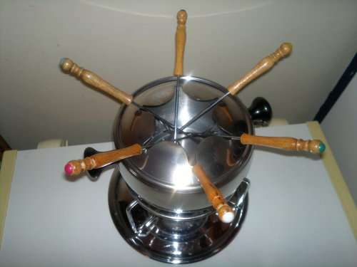 A all most new Stainless Steel Fondue Set with 6 color coded handle Forks. All in neat condition.