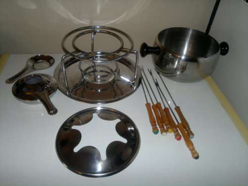 A all most new Stainless Steel Fondue Set with 6 color coded handle Forks. All in neat condition.
