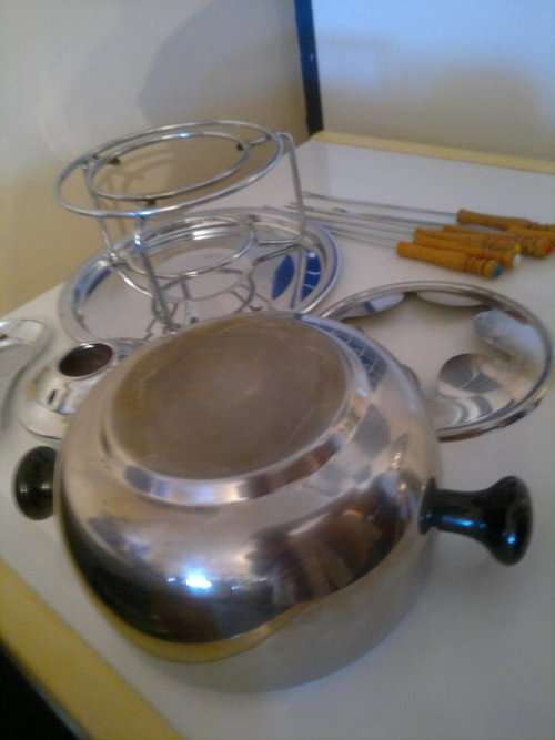 A all most new Stainless Steel Fondue Set with 6 color coded handle Forks. All in neat condition.