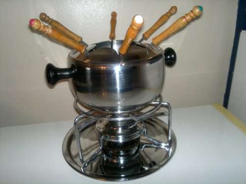 A all most new Stainless Steel Fondue Set with 6 color coded handle Forks. All in neat condition.