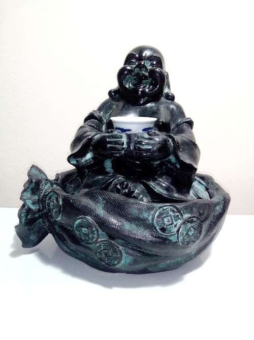 Large Green Buda with (We Think) ceramic?  bowl sitting on a money bag. In good condition.