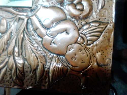 Bargain an impressive wall mirror . Hand beaten ornate copper wall mirror, 4 Angels on the corners .