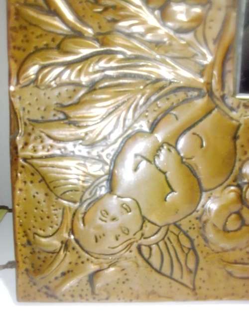 Bargain an impressive wall mirror . Hand beaten ornate copper wall mirror, 4 Angels on the corners .