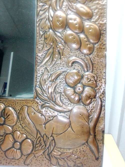 Bargain an impressive wall mirror . Hand beaten ornate copper wall mirror, 4 Angels on the corners .