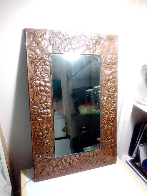 Bargain an impressive wall mirror . Hand beaten ornate copper wall mirror, 4 Angels on the corners .