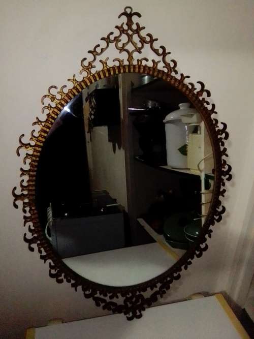 Awesome A 1900`s Wrought iron wall hanging mirror in fair to good used condition.