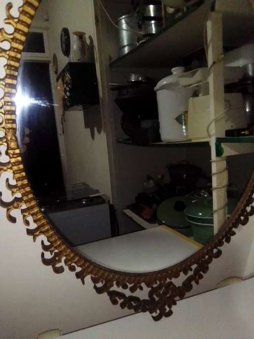 Awesome A 1900`s Wrought iron wall hanging mirror in fair to good used condition.