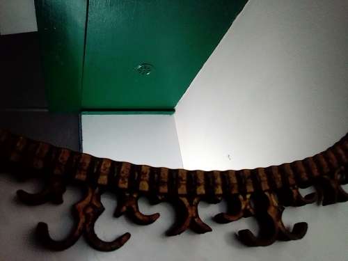 Awesome A 1900`s Wrought iron wall hanging mirror in fair to good used condition.