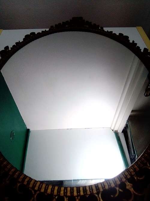 Awesome A 1900`s Wrought iron wall hanging mirror in fair to good used condition.