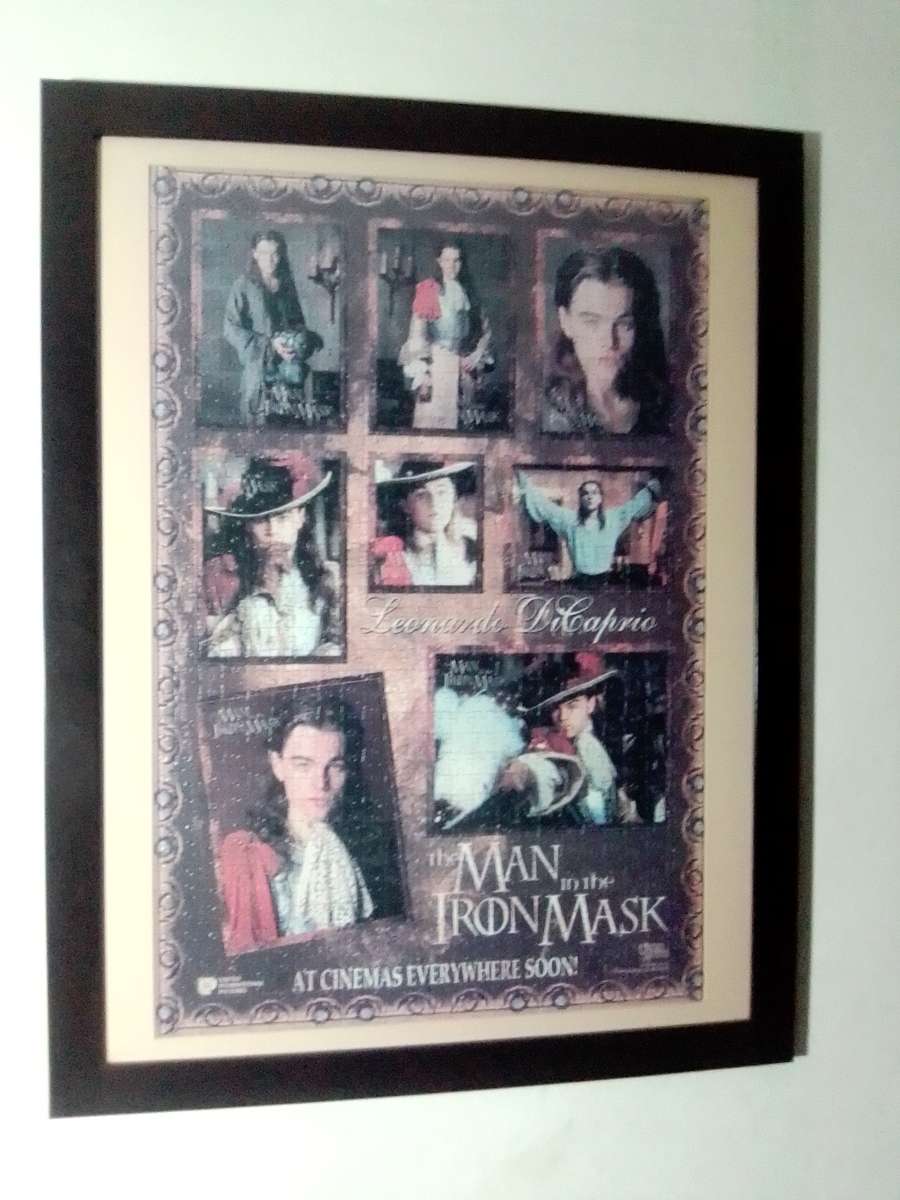 `The Man in the Iron Mask` staring Leonardo De Caprio Puzzel under glass in a solid wood frame.