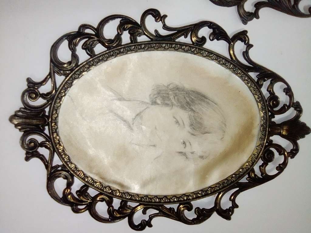 Ornate two photo frames. Both are Brass with Silk litho prints and stamped ITALY.