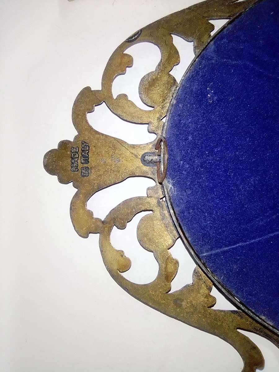 Ornate two photo frames. Both are Brass with Silk litho prints and stamped ITALY.