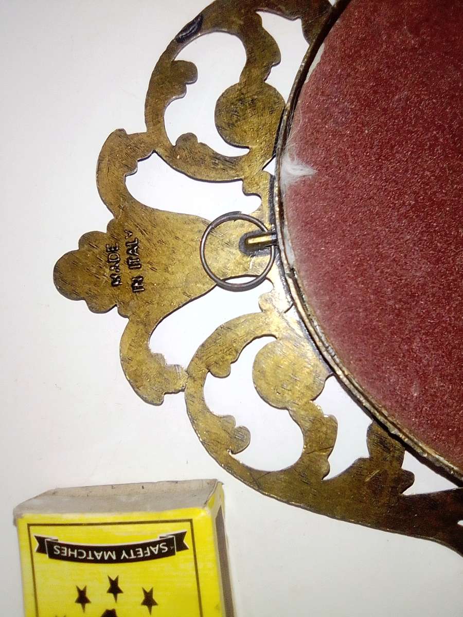 Ornate two photo frames. Both are Brass with Silk litho prints and stamped ITALY.