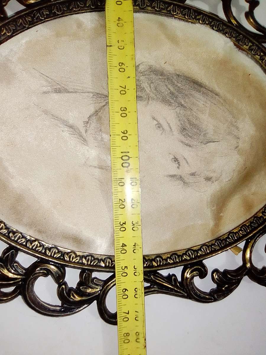 Ornate two photo frames. Both are Brass with Silk litho prints and stamped ITALY.