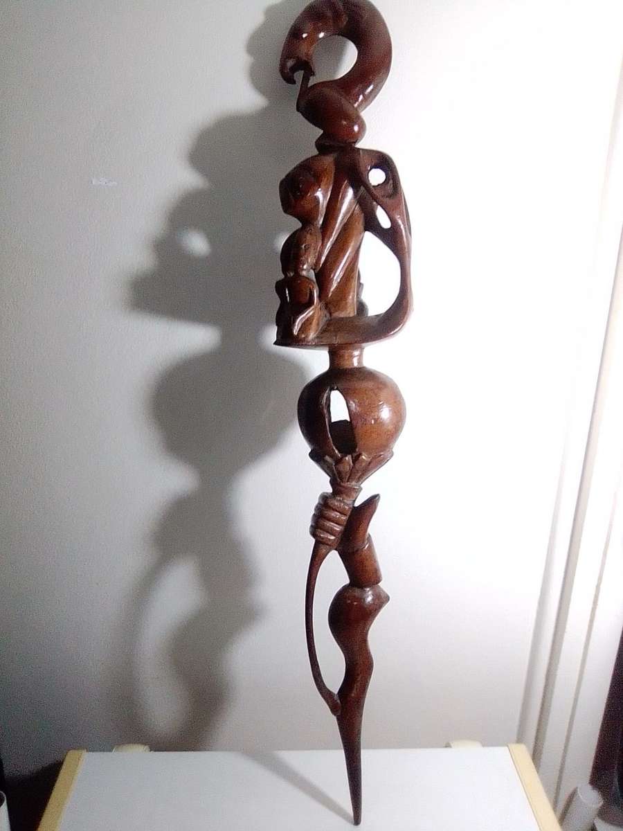 The Nyaminyami is described as having the body of a snake the head of a fish. Ethnic Walking Stick.