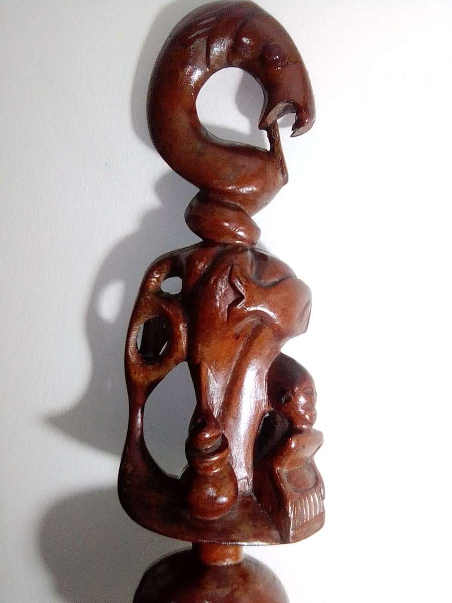 The Nyaminyami is described as having the body of a snake the head of a fish. Ethnic Walking Stick.