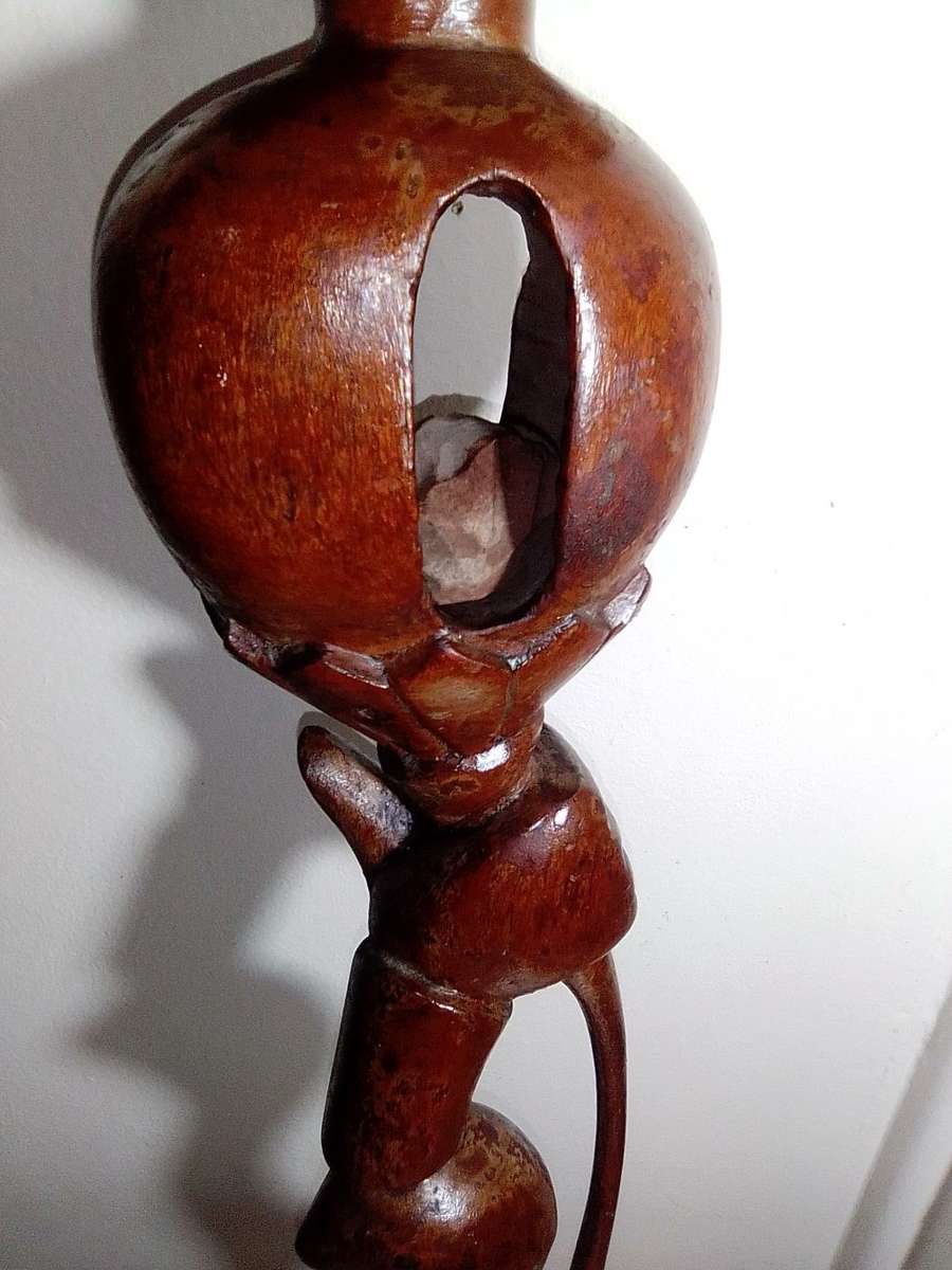 The Nyaminyami is described as having the body of a snake the head of a fish. Ethnic Walking Stick.