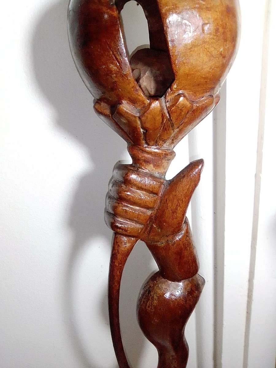 The Nyaminyami is described as having the body of a snake the head of a fish. Ethnic Walking Stick.