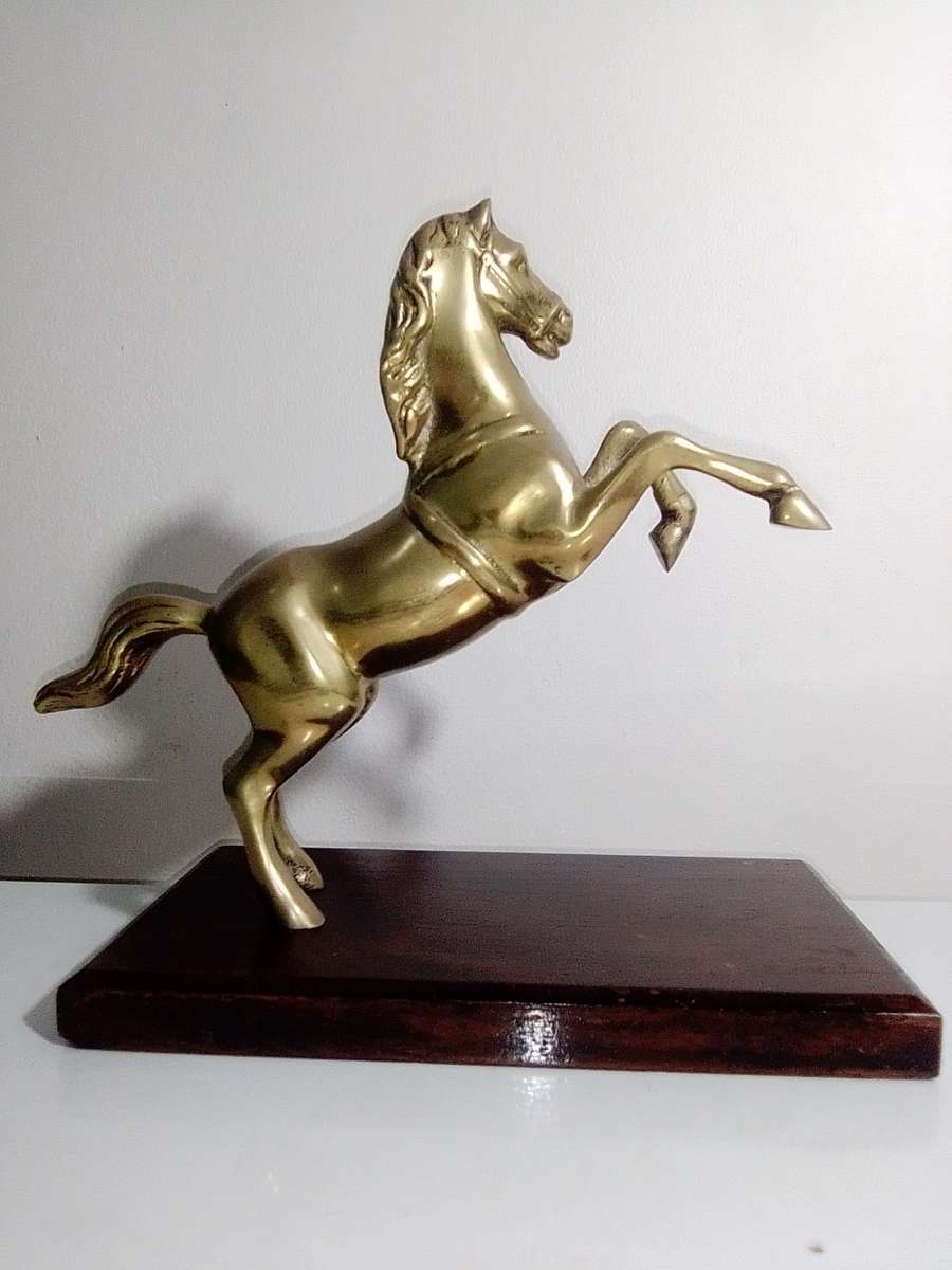 A Old very heavy 2.6Kg Brass Stallion rearing up on wood stand. A Impressive solid Brass horse.