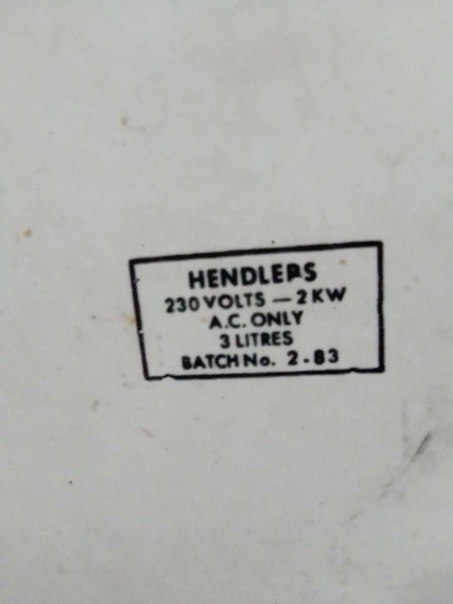 A Hendlers whistling white Enamel manual 3 footed electric 3Lt Kettle a flower motif.