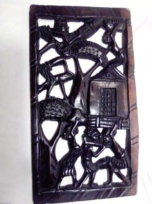 Rare African Trible art wooden wall merual carving from the Ivory Coast and a Drummer Statue.