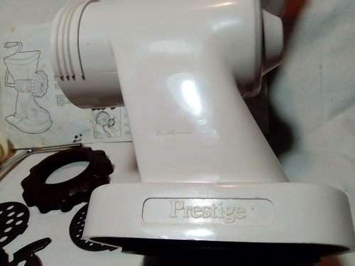 In Good working order. Original box. Prestage Mincer made in ITALY. hand driven, table suction.