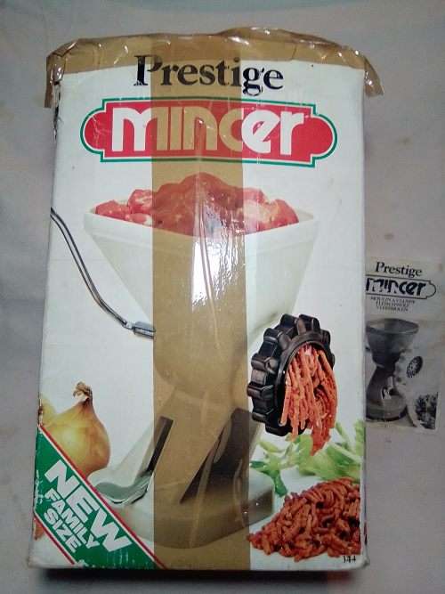 In Good working order. Original box. Prestage Mincer made in ITALY. hand driven, table suction.