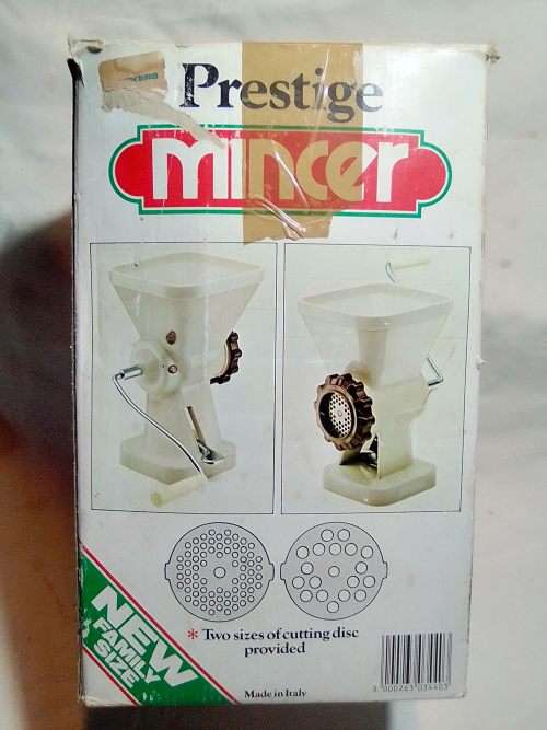 In Good working order. Original box. Prestage Mincer made in ITALY. hand driven, table suction.